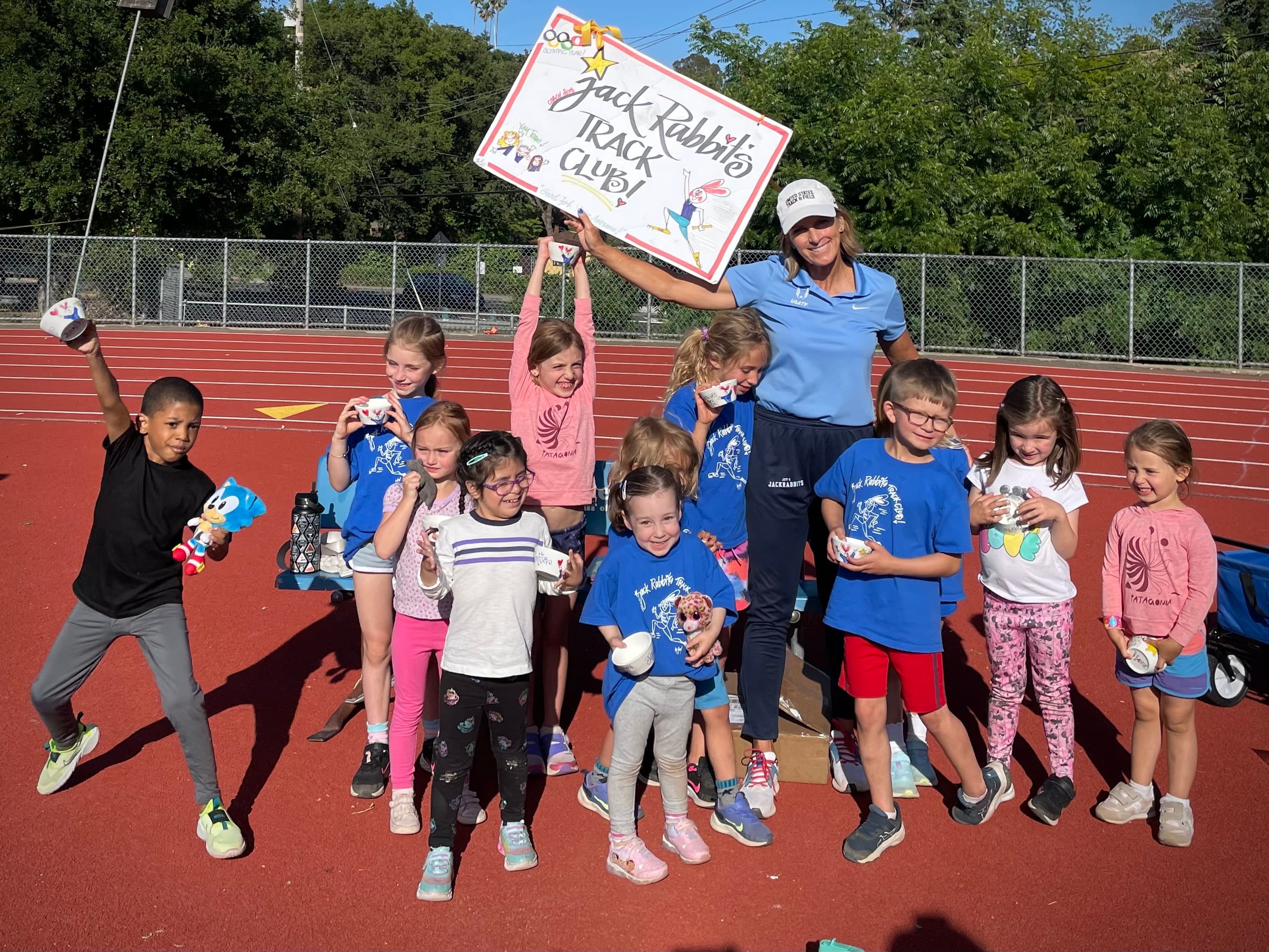Joy with Jackrabbits athletes on the track